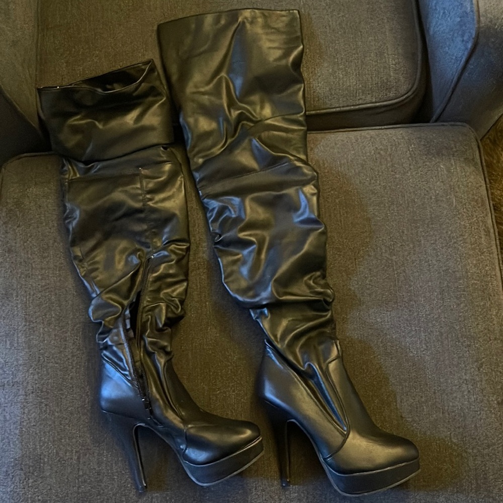 Thigh high black boot